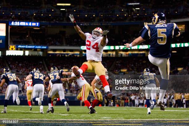 Michael Robinson of the San Francisco 49ers looks to block a punt against Donnie Jones of the St. Louis Rams at the Edward Jones Dome on January 3,...