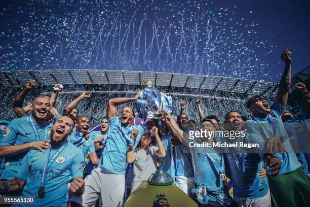 Editor's note - digital filters were used in the creation of this image] Vincent Kompany and Sergio Aguero of Manchester City lift the Premier League...