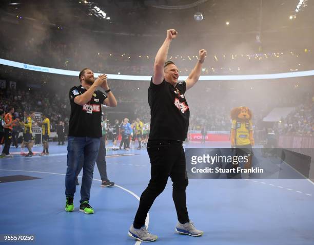 Oliver Roggisch, manager of Rhein-Neckar celebrates with head coach Nikolaj Jacobsen during the final of the DKB Handball Bundesliga Final Four...