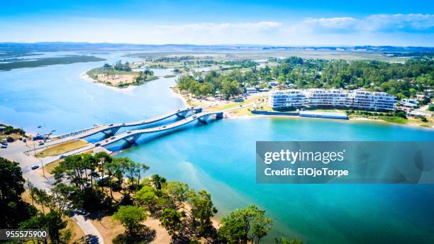 aerial view, high angle view of la barra bridge, punta del este city, uruguay - río del este fotografías e imágenes de stock