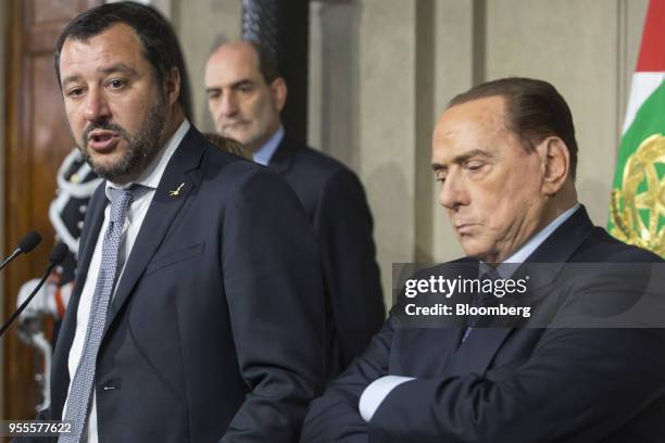 Matteo Salvini, leader of the euroskeptic party League, left, speaks as Silvio Berlusconi, leader of the Forza Italia party, looks on during a news...