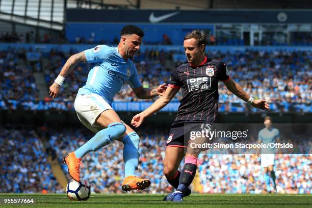 Kyle Walker of Man City battles with Chris Lowe of Huddersfield during the Premier League match between Manchester City and Huddersfield Town at the...