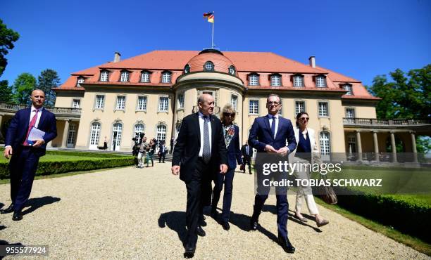 German Foreign Minister Heiko Maas and his French counterpart Jean-Yves Le Drian take a walk outside the German Foreign Ministry's Villa Borsig...