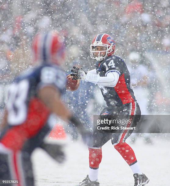 Ryan Fitzpatrick of the Buffalo Bills readies to throw a pass to teammate Lee Evans against the Indianapolis Colts at Ralph Wilson Stadium on January...