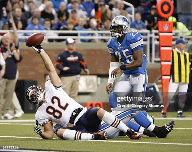 Greg Olsen of the Chicago Bears celebrates a second quarter touchdown in front of Marvin White of the Detroit Lions on January 3, 2010 at Ford Field...