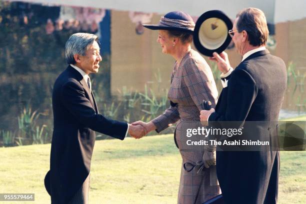 Emperor Akihito talks with Queen Margrethe II and her husband Prince Henrik of Denmark during the garden party celebrating his Enthronement at the...