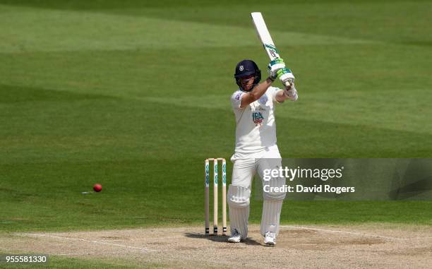 Liam Dawson of Hampshire drives the ball for four runs during day four of the Specsavers County Championship Division One match between...