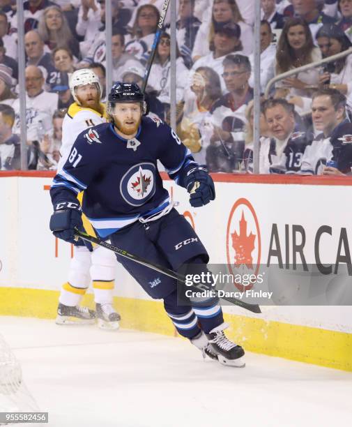 Kyle Connor of the Winnipeg Jets follows the play around the boards during first period action against the Nashville Predators in Game Four of the...