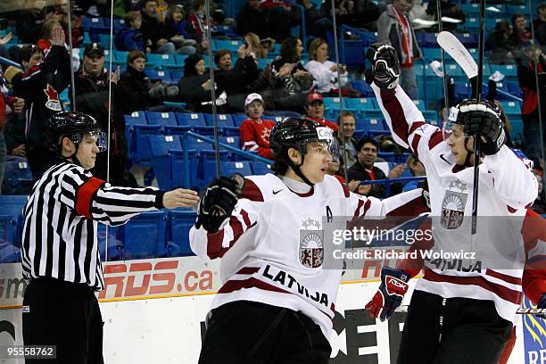 Raimonds Vilkoits of Team Latvia celebrates Team Latvia's first goal of the game against Team Czech Republic during the 2010 IIHF World Junior...