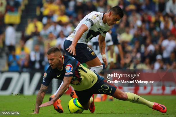 Jeremy Menez of America struggles for the ball against Pablo Barrera of Pumas during the quarter finals second leg match between America and Pumas...