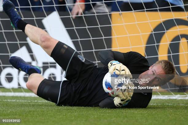 Sporting Kansas City goalkeeper Tim Melia makes a diving save in warmups before an MLS match between the Colorado Rapids and Sporting Kansas City on...