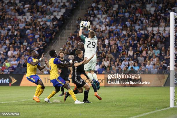 Sporting Kansas City goalkeeper Tim Melia leaps to make the save in the second half of an MLS match between the Colorado Rapids and Sporting Kansas...