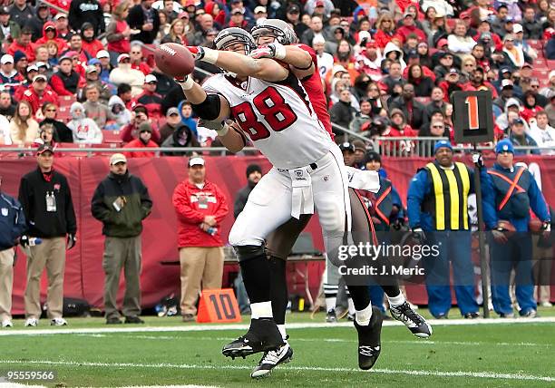 Safety Sabby Piscitelli of the Tampa Bay Buccaneers breaks up this pass intended for tightend Tony Gonzalez of the Atlanta Falcons during the game at...