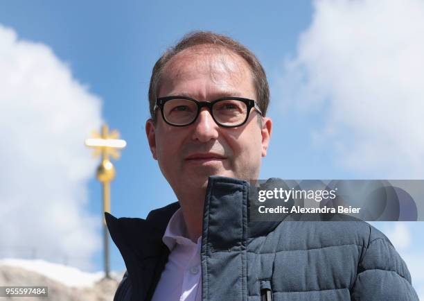 Alexander Dobrindt, leader of the Bundestag faction of the Bavarian Christian Democrats , poses for a photo next to Zugspitze mountain on May 7, 2018...