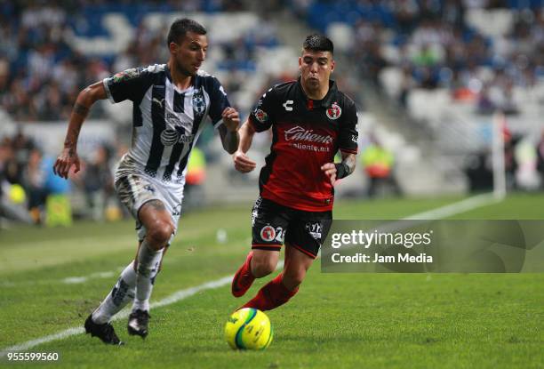 Jonathan Urretaviscaya of Monterrey and Luis Mendoza of Tijuana fight for the ball during the quarter finals second leg match between Monterrey and...