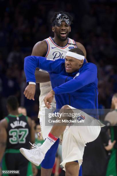 Joel Embiid and Justin Anderson of the Philadelphia 76ers react against the Boston Celtics during Game Three of the Eastern Conference Second Round...