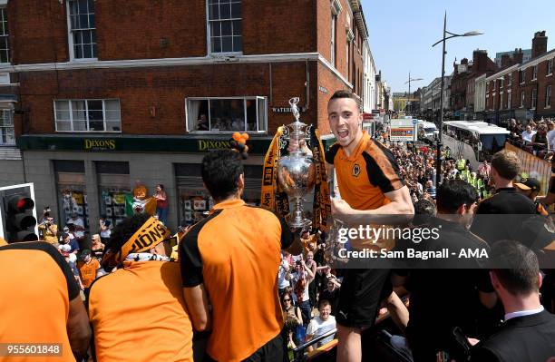 Diogo Jota of Wolverhampton Wanderers with the trophy during their celebrations of winning the Sky Bet Championship on a winners parade around the...