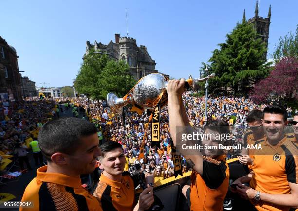 Ruben Neves of Wolverhampton Wanderers with the trophy during their celebrations of winning the Sky Bet Championship on a winners parade around the...