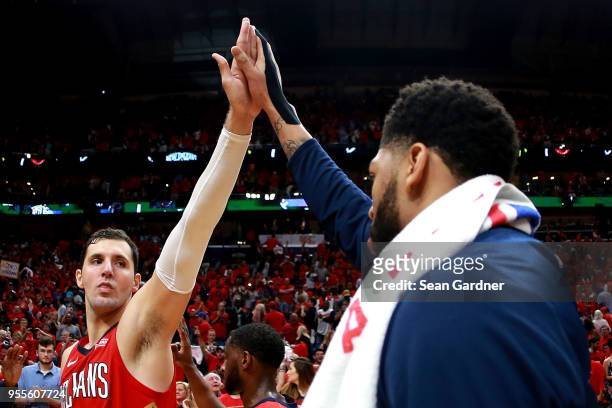 Nikola Mirotic of the New Orleans Pelicans and Anthony Davis of the New Orleans Pelicans react after defeating the Golden State Warriors during Game...