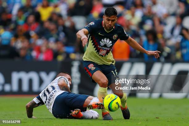 Nicolas Castillo of Pumas fights for the ball with Bruno Valdez of America during the quarter finals second leg match between America and Pumas UNAM...