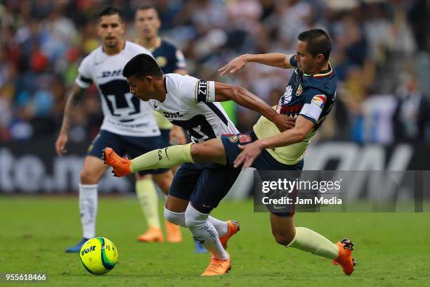 Jesus Gallardo of Pumas fights for the ball with Paul Aguilar of America during the quarter finals second leg match between America and Pumas UNAM as...