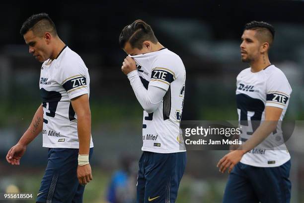 Players of Pumas react during the quarter finals second leg match between America and Pumas UNAM as part of the Torneo Clausura 2018 Liga MX at...
