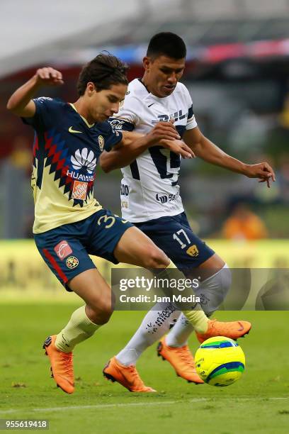 Diego Lainez of America fights for the ball with Jesus Gallardo of Pumas during the quarter finals second leg match between America and Pumas UNAM as...