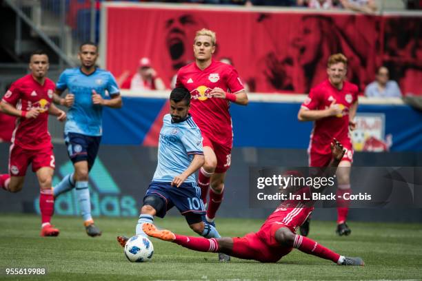 Kemar Lawrence of New York Red Bulls stops the advance by Maximiliano Moralez of New York City during the New York Derby Major League Soccer match...