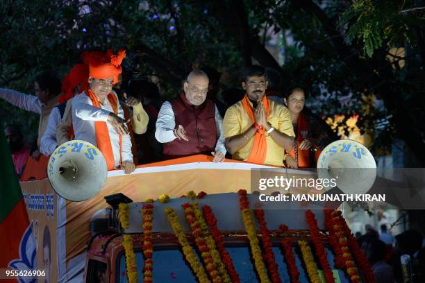Bharatiya Janatha Party President, Amit Shah , gestures as he takes part in a election campaign rally in support of the party's local candidate for...