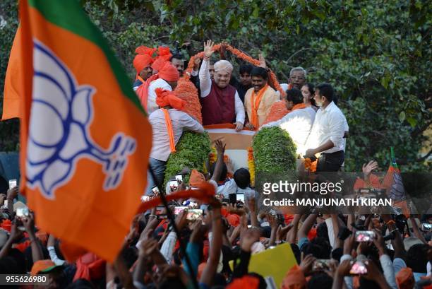 Bharatiya Janatha Party President, Amit Shah , gestures as he takes part in a election campaign rally in support of the party's local candidate for...