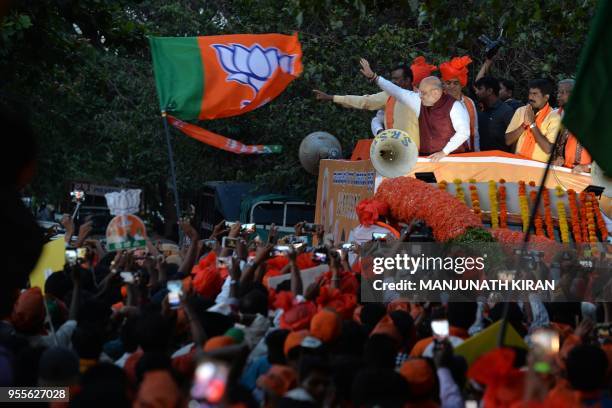 Bharatiya Janatha Party President, Amit Shah , gestures as he takes part in a election campaign rally in support of the party's local candidate for...