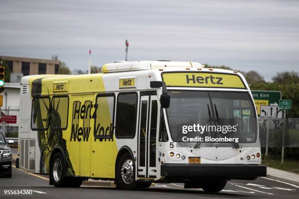 Hertz Global Holdings Inc. Shuttle bus travels through LaGuardia Airport in the Queens borough of New York, U.S., on Sunday, May 2018. Hertz Global...