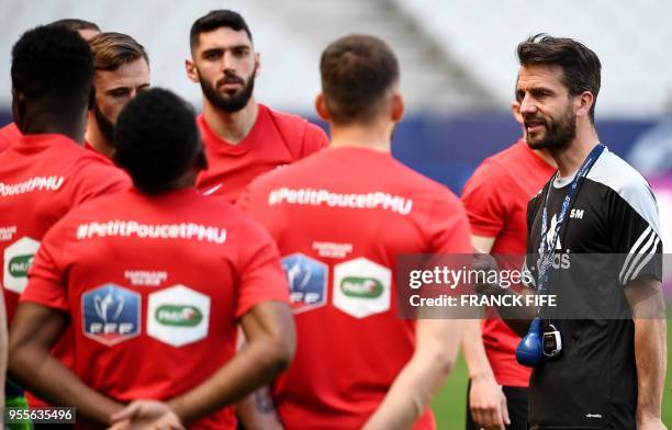 Les Herbiers' headcoach Stephane Masala speaks to his players during a training session at the Stade de France in Saint-Denis, north of Paris, on May...