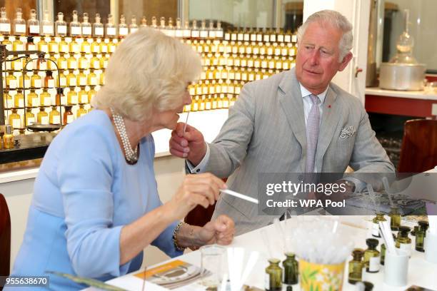 Prince Charles, Prince of Wales and Camilla, Duchess of Cornwall test various scents during a visit to the Fragonard Perfumery on May 7, 2018 in Eze,...