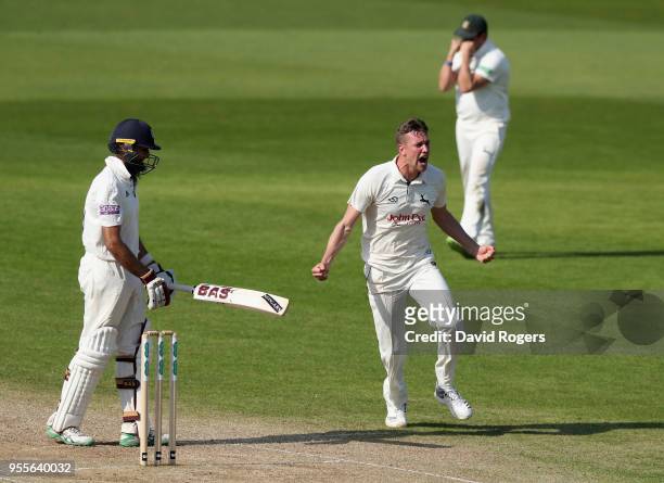 Jake Ball of Nottinghamshire celebrates after taking the match winning wicket of Hashim Amla during day four of the Specsavers County Championship...