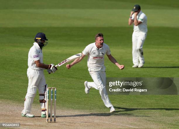 Jake Ball of Nottinghamshire celebrates after taking the match winning wicket of Hashim Amla during day four of the Specsavers County Championship...