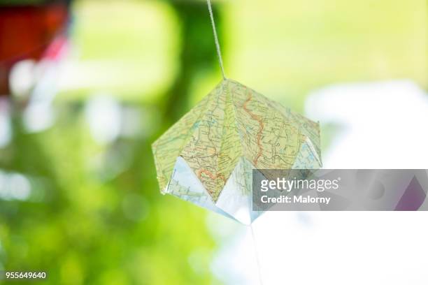 map folded and used as decoration at a party. - wedding guest gifts stock pictures, royalty-free photos & images