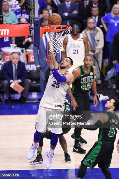 Ben Simmons of the Philadelphia 76ers lays up a shot against Shane Larkin of the Boston Celtics in overtime during Game Three of the Eastern...