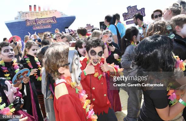 Children dressed as monsters attend a colourful photocall at the 71st Cannes Film Festival with monster characters to launch a sneak peek of 'Hotel...
