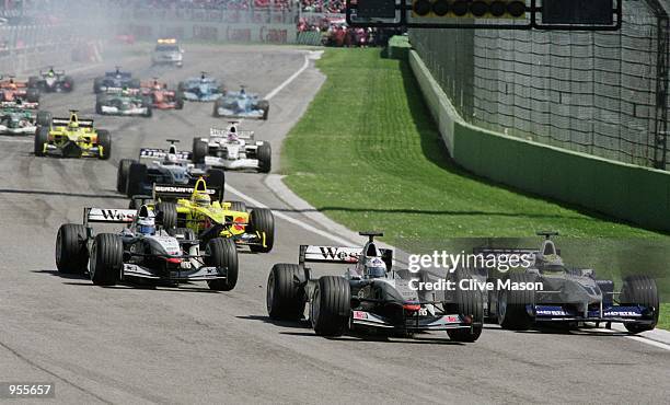 Williams-BMW driver Ralf Schumacher of Germany dives up the inside to take a race lead during the San Marino Formula One Grand Prix held in Imola,...