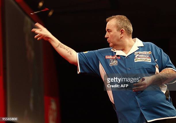 England's 14 times World champion Phil Taylor competes during his final match against Australia's Simon Whitlock , at the Professional Darts...