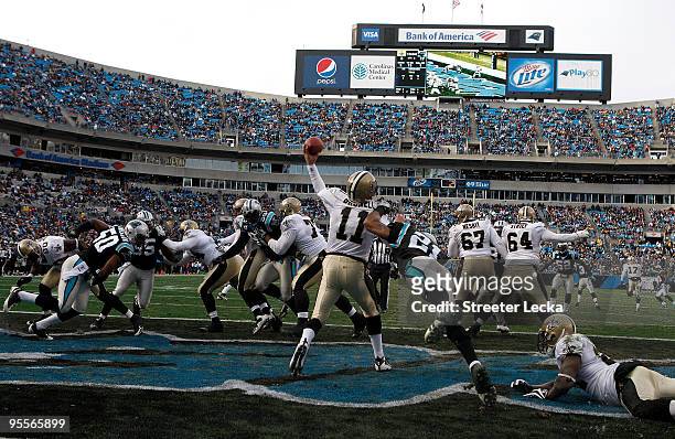 Mark Brunell of the New Orleans Saints is hit from behind against the Carolina Panthers during their game at Bank of America Stadium on January 3,...