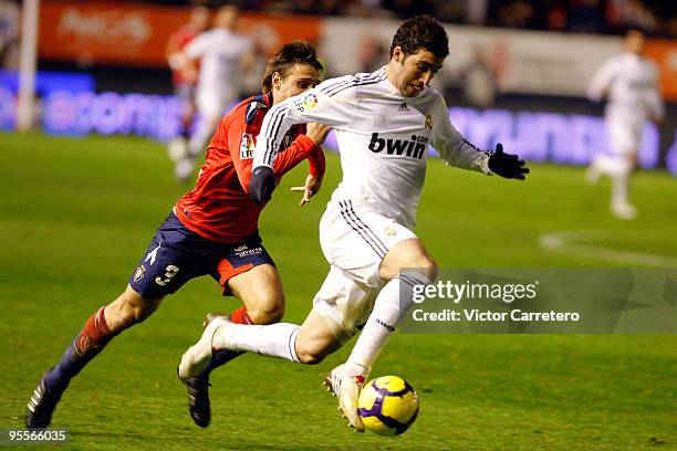Gonzalo Higuain of Real Madrid in action during the La Liga match between Osasuna and Real Madrid at Estadio Reyno de Navarra on January 3, 2010 in...