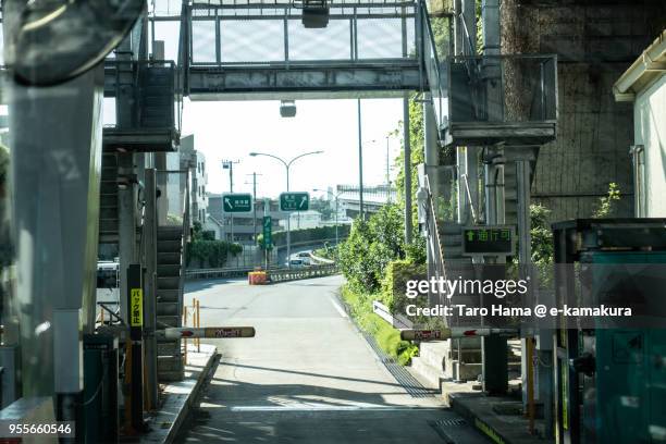 hino interchange toll booth of yokohama-yokosuka road in yokohama city in japan daytime aerial view from airplane - toll booth stock-fotos und bilder