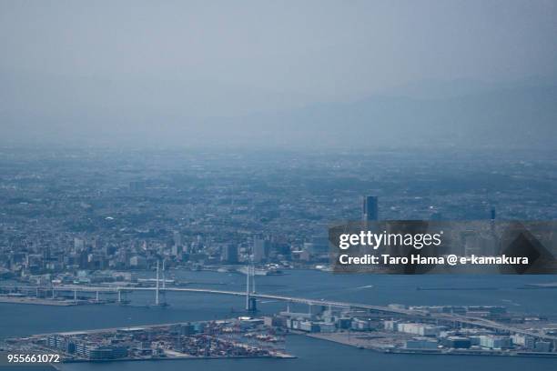 yokohama minato mirai area, yokohama harbor and yokohama bay bridge in yokohama city in japan daytime aerial view from airplane - yokohama bay bridge stock pictures, royalty-free photos & images