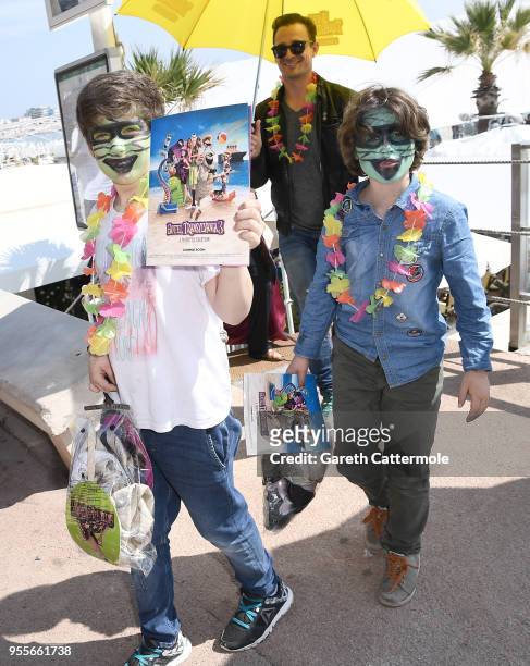 Children dressed as monsters after they attend a colourful photocall to launch a sneak peek of 'Hotel Transylvania 3' during the 71st Cannes Film...