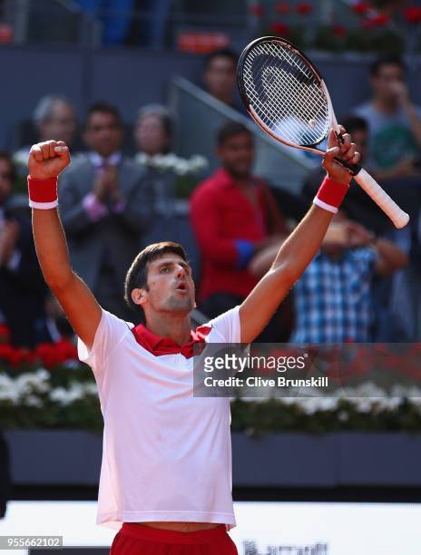 Novak Djokovic of Serbia celebrates to the crowd after his straight sets victory against Kei Nishikori of Japan in their first round match during day...