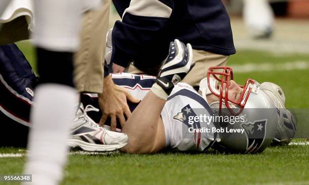 Wide receiver Wes Welker of the New England Patriots is tended to by medical personnel after injuring his leg against the Houston Texans at Reliant...