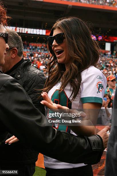 Performing artist Fergie greets fellow performing artist Gloria Estefan on the field before the Pittsburgh Steelers take on the Miami Dolphins at...
