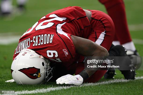 Dominique Rodgers-Cromartie of the Arizona Cardinals lays on the field injured in the first quarter against the Green Bay Packers at University of...